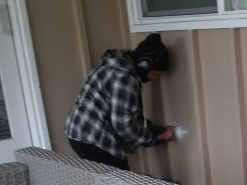 Professional electrician installing an exterior outlet in Donna