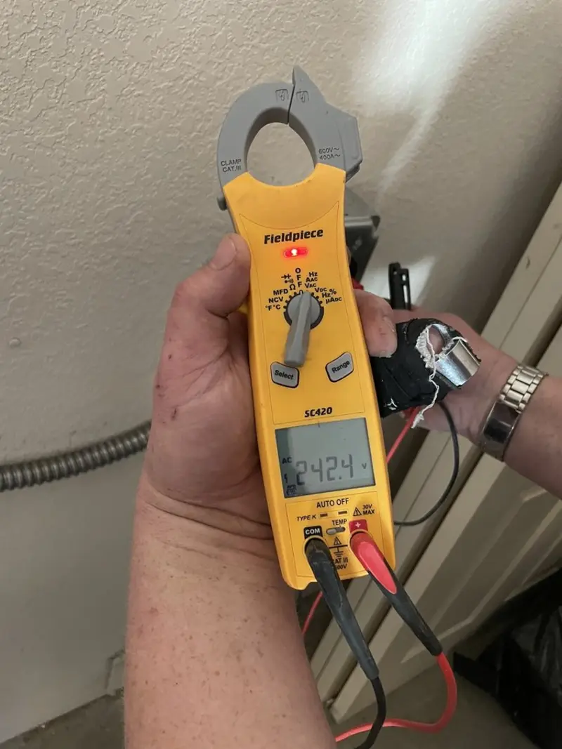 Voltage testing with clamp meter during Generator Installation in Donna